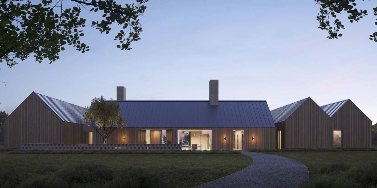 Modern residential house with vertical wood siding and metal roof at dusk.