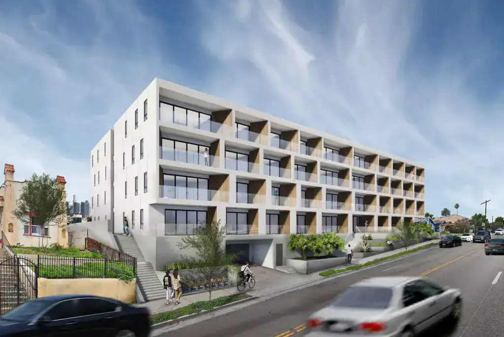 Contemporary hillside residential building with modular balconies and indoor–outdoor living spaces.