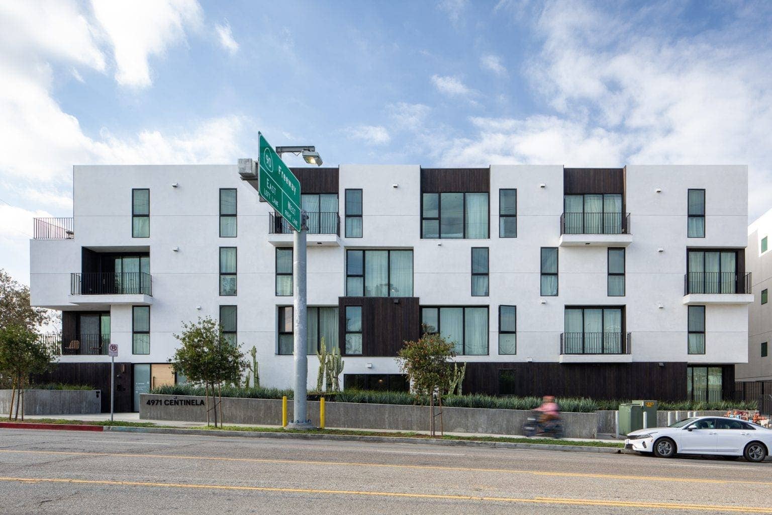 Contemporary multi-family residential building with modern design and clean lines.