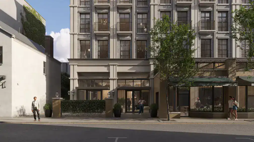 Hotel building with modern classic architectural style, grey brick façade, large windows, and balconies, landscaped ground floor entrance, ambient lighting.