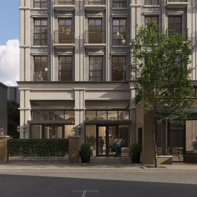 Hotel building with modern classic architectural style, grey brick façade, large windows, and balconies, landscaped ground floor entrance, ambient lighting.