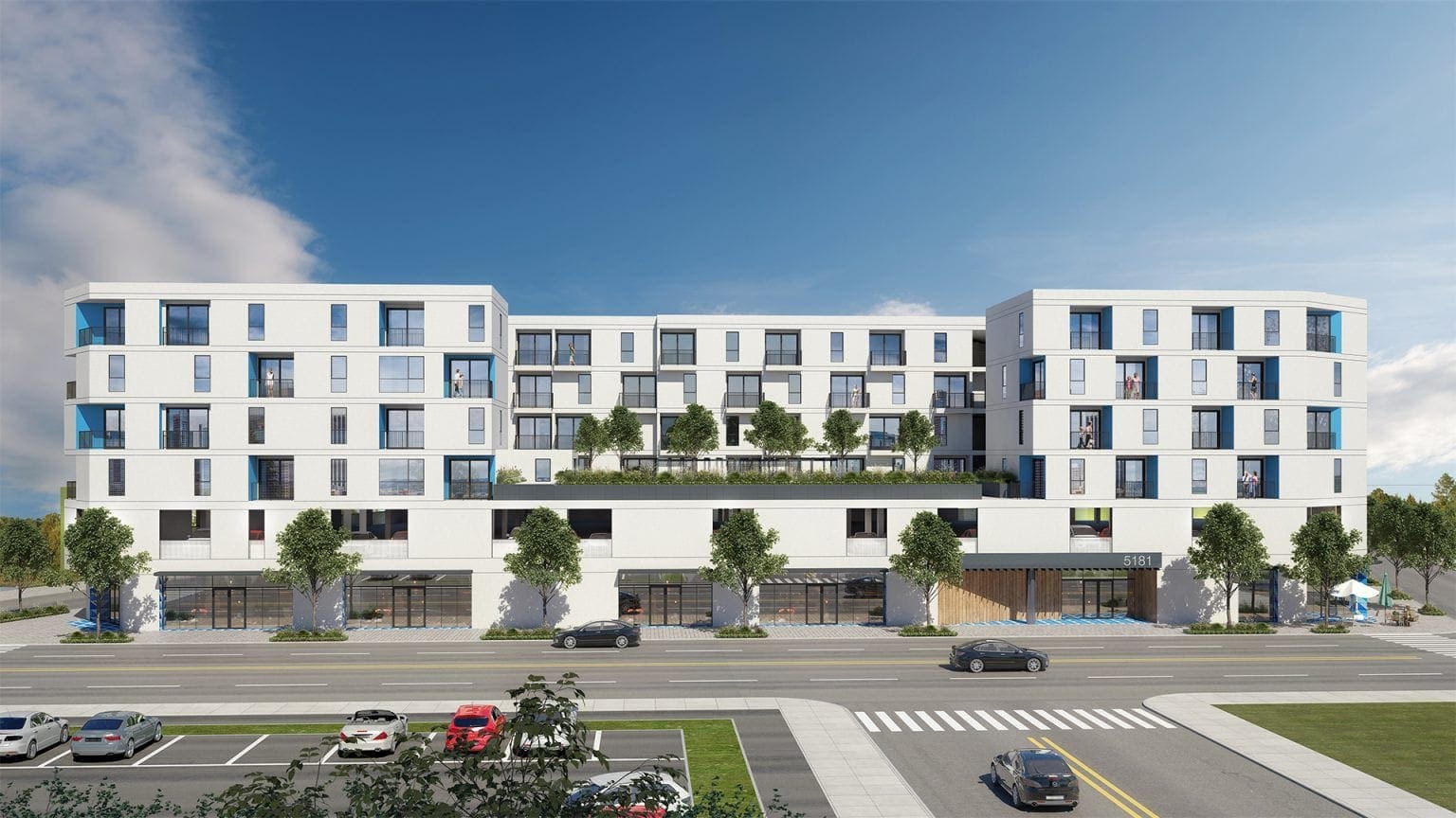 Modern residential apartment building exterior with landscaped terraces and retail spaces on the ground floor.